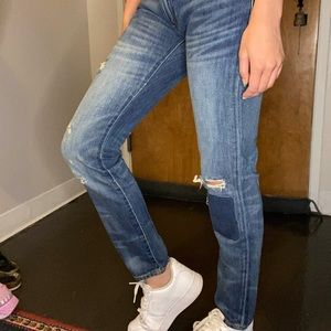 Low rise polo ripped/patched jeans